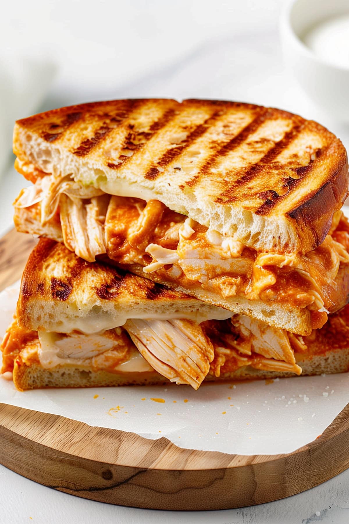 Flavorful buffalo chicken panini, featuring hot sauce and creamy ranch.