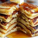 Close Up of IHOP Pancake Recipe Pancake Stack, Missing a Bite with Butter and Maple Syrup