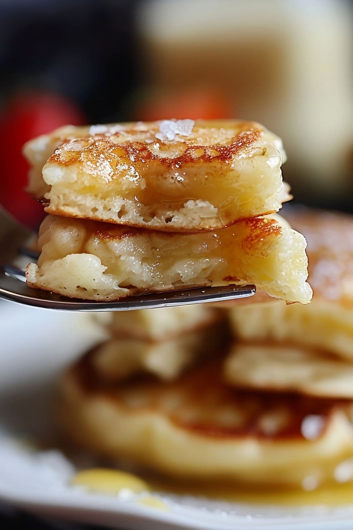 Close Up of a Bite of IHOP Pancake Recipe Pancakes with Maple Syrup on a Fork