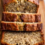 Close Up of a Loaf of Paula Deen Banana Bread, Sliced on a Wooden Cutting Board