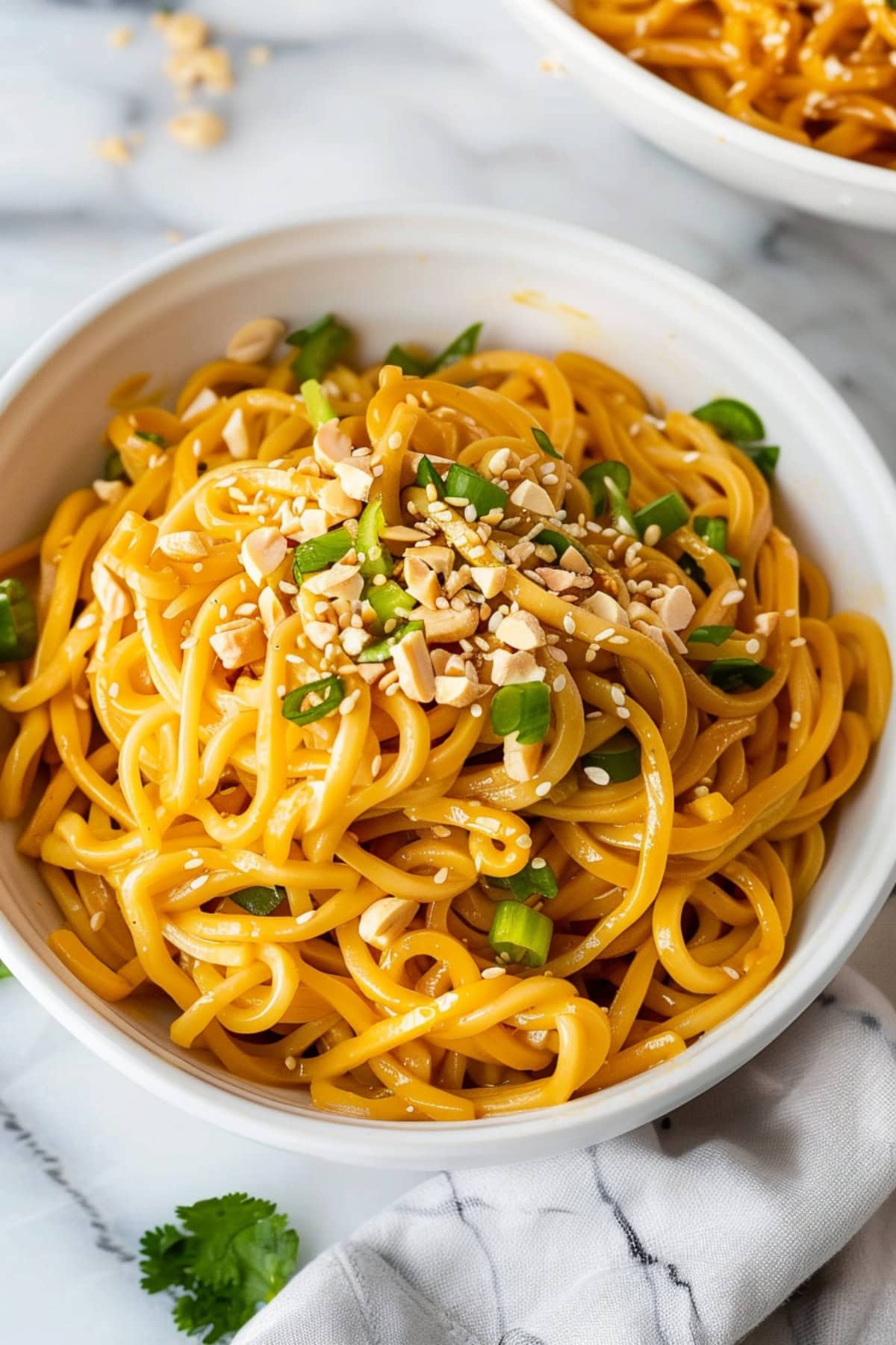 Classic sesame noodles, served chilled and topped with thinly green onions and crushed peanuts.