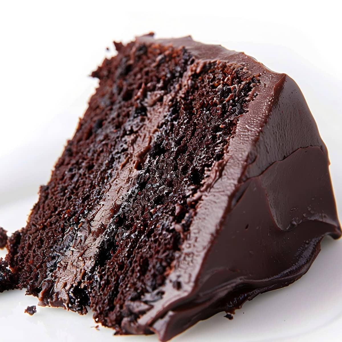 A slice of Chocolate Truffle Cake served on a white plate.