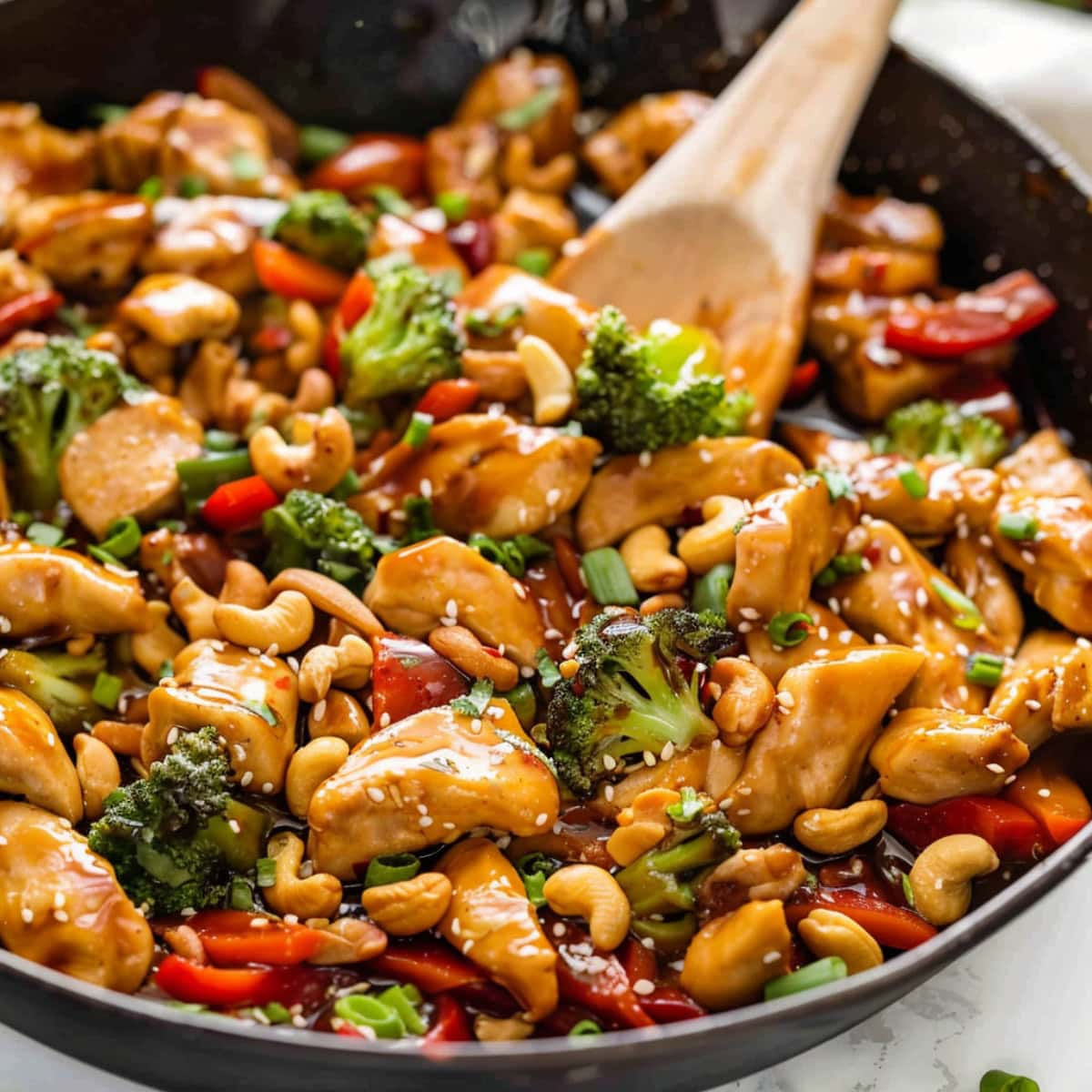 Stir-Fry chicken and vegetables with teriyaki sauce in a skillet.