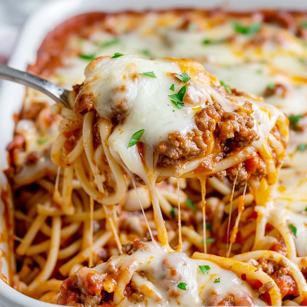 Creamy TikTok spaghetti with a rich tomato and cheese sauce, topped with fresh basil.