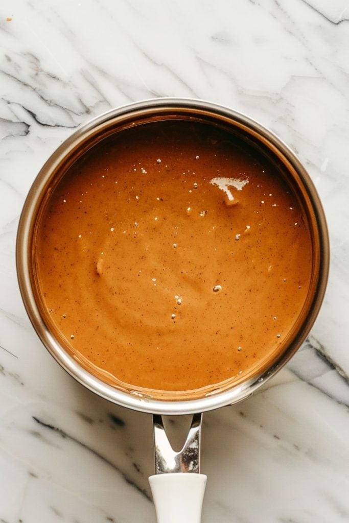 Peanut butter sauce in a saucepan.