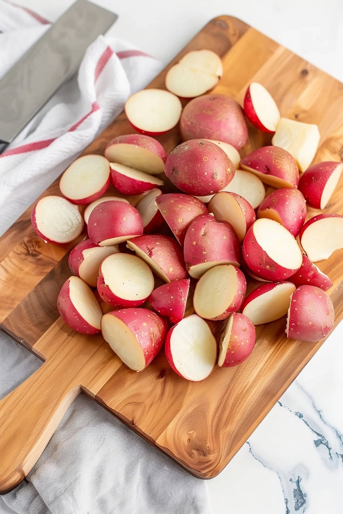 Baby red potato slices on a wooden board