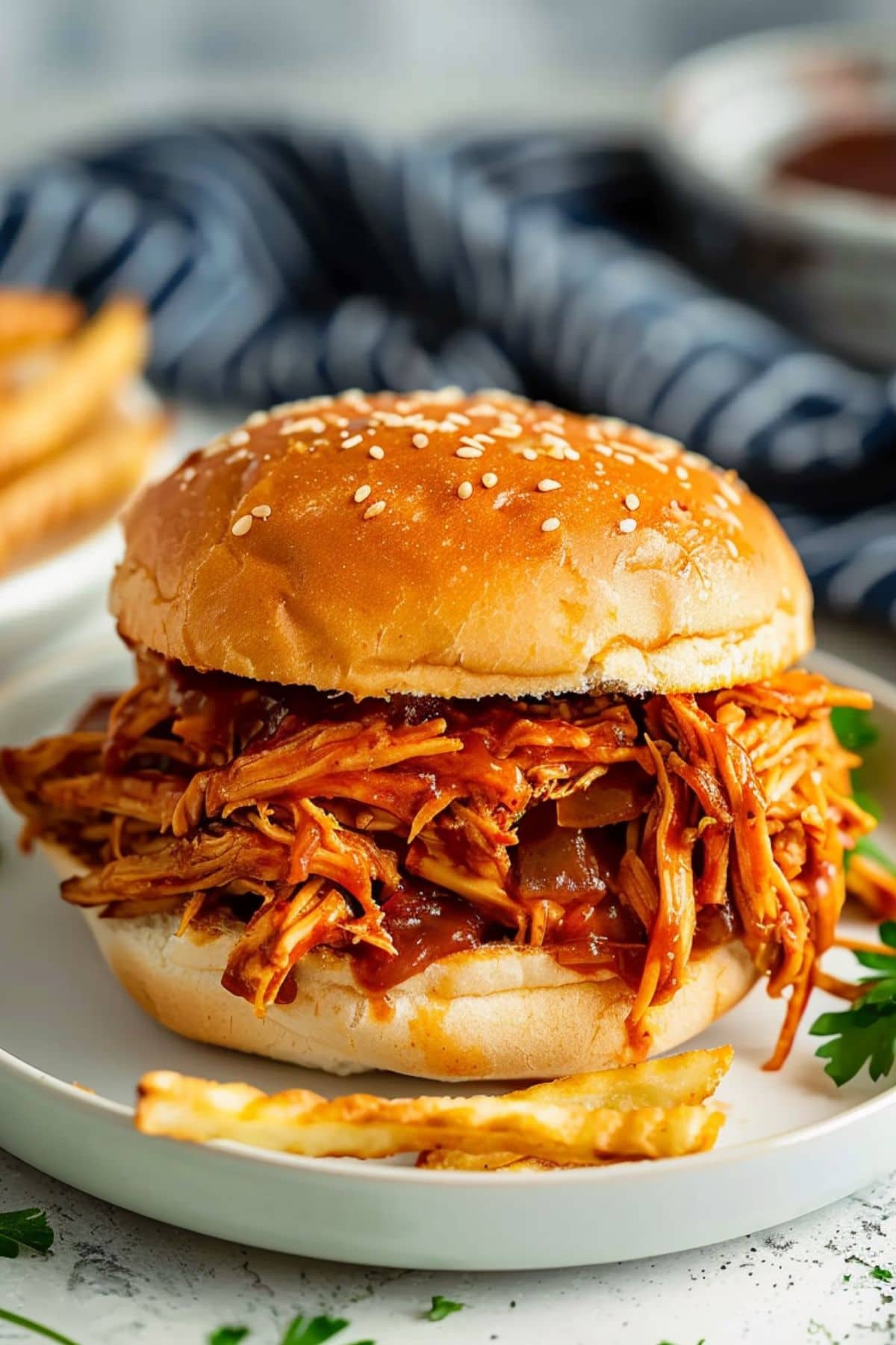 Shredded bbq chicken inside buns sandwich.