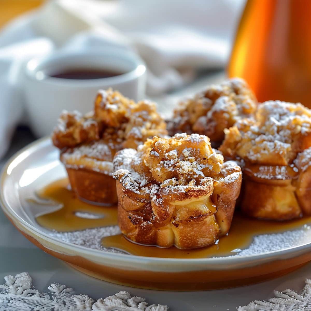 Four French Toast Muffins Served with a Cup of Coffee.