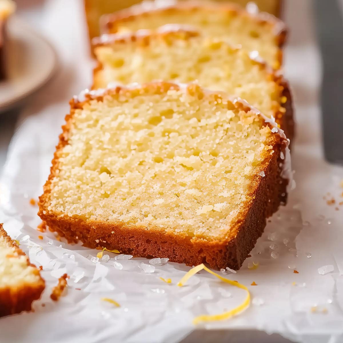 Lemon Drizzle Cake Slices on Parchment Paper, Close-up