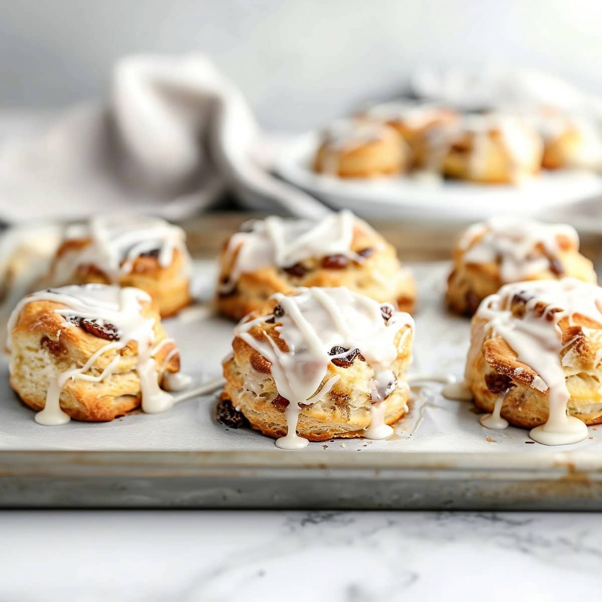 Warm cinnamon raisin biscuits with a golden brown crust.