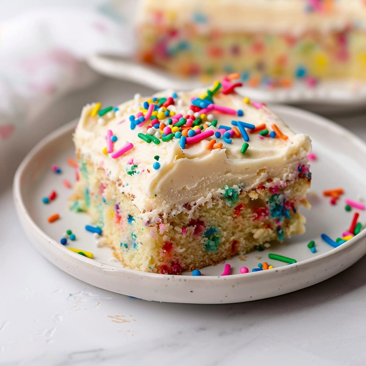 A Piece of Funfetti Sheet Cake Square in a Plate