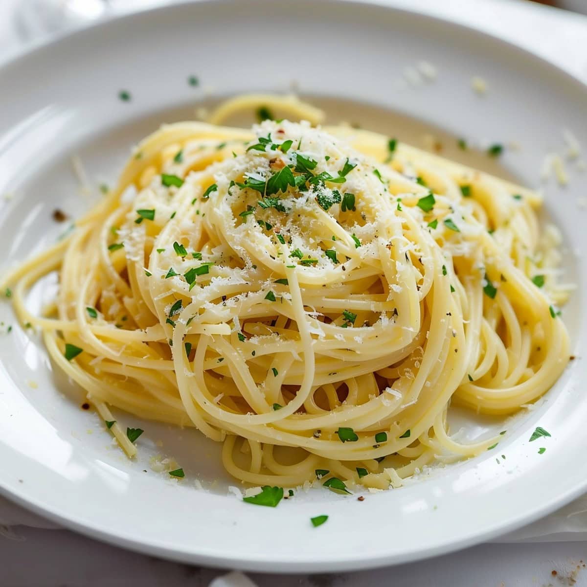 Homemade Garlic Parmesan Pasta in a White Plate.