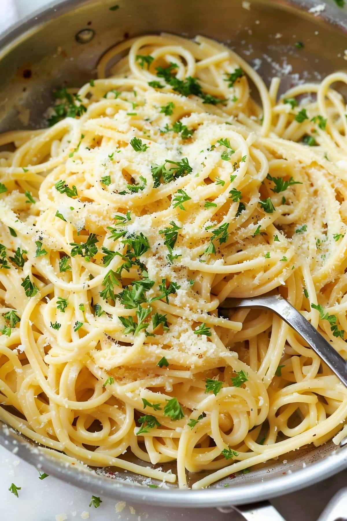 Homemade garlic parmesan pasta, served hot and topped with freshly grated cheese.