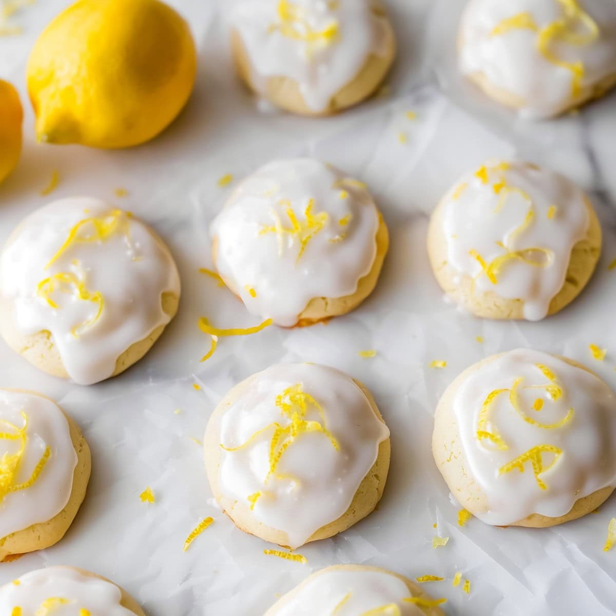 Lemon meltaway cookies on a white parchment paper.