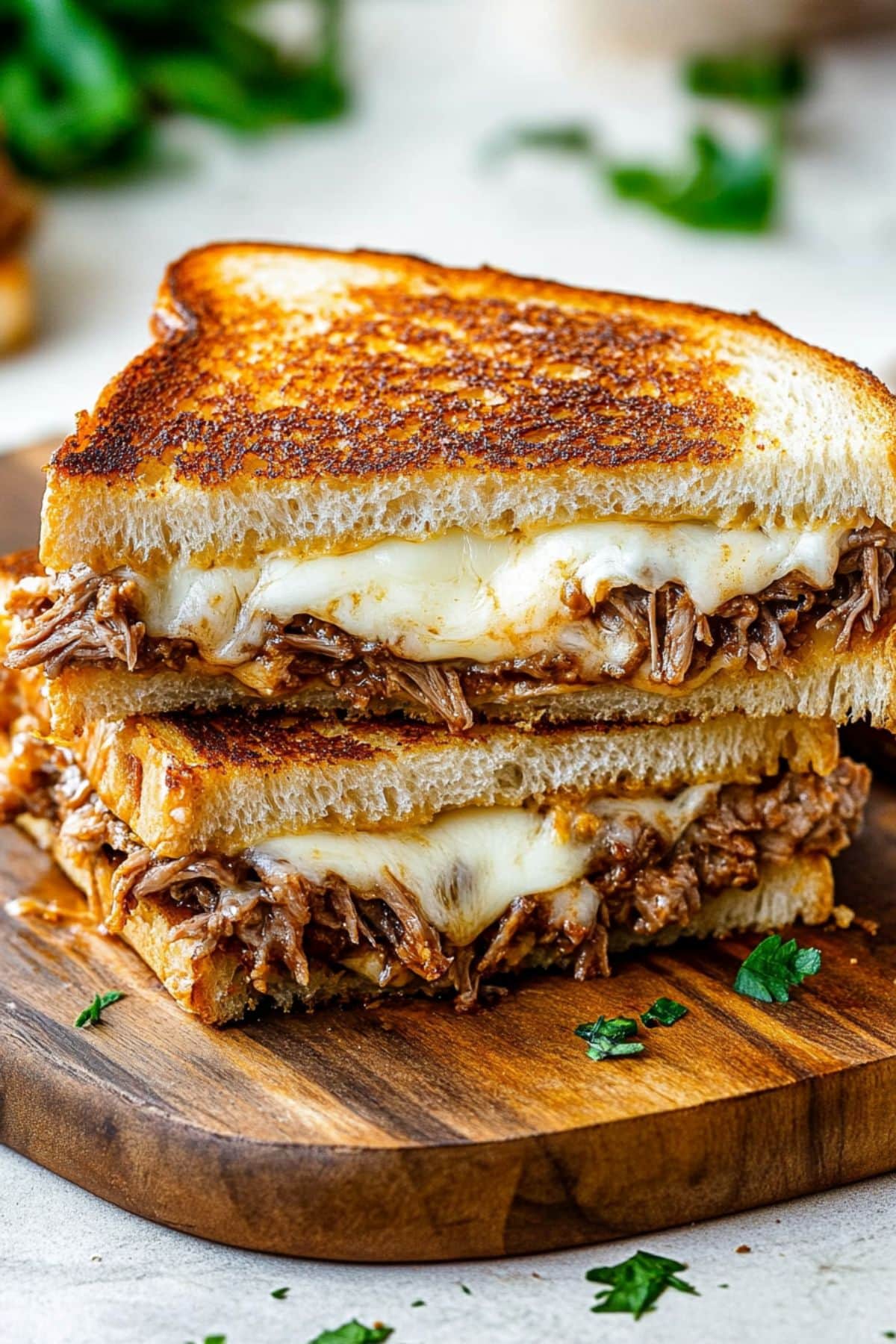 Birria grilled cheese with melted cheese and shredded beef filling.