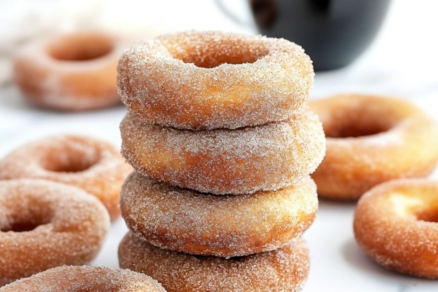 Canned biscuits donuts coated in cinnamon sugar.