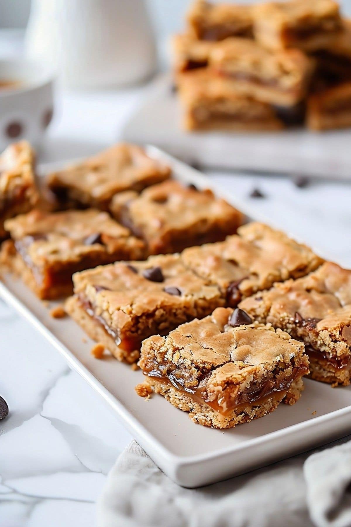 Sliced carmelitas served on a white plate.