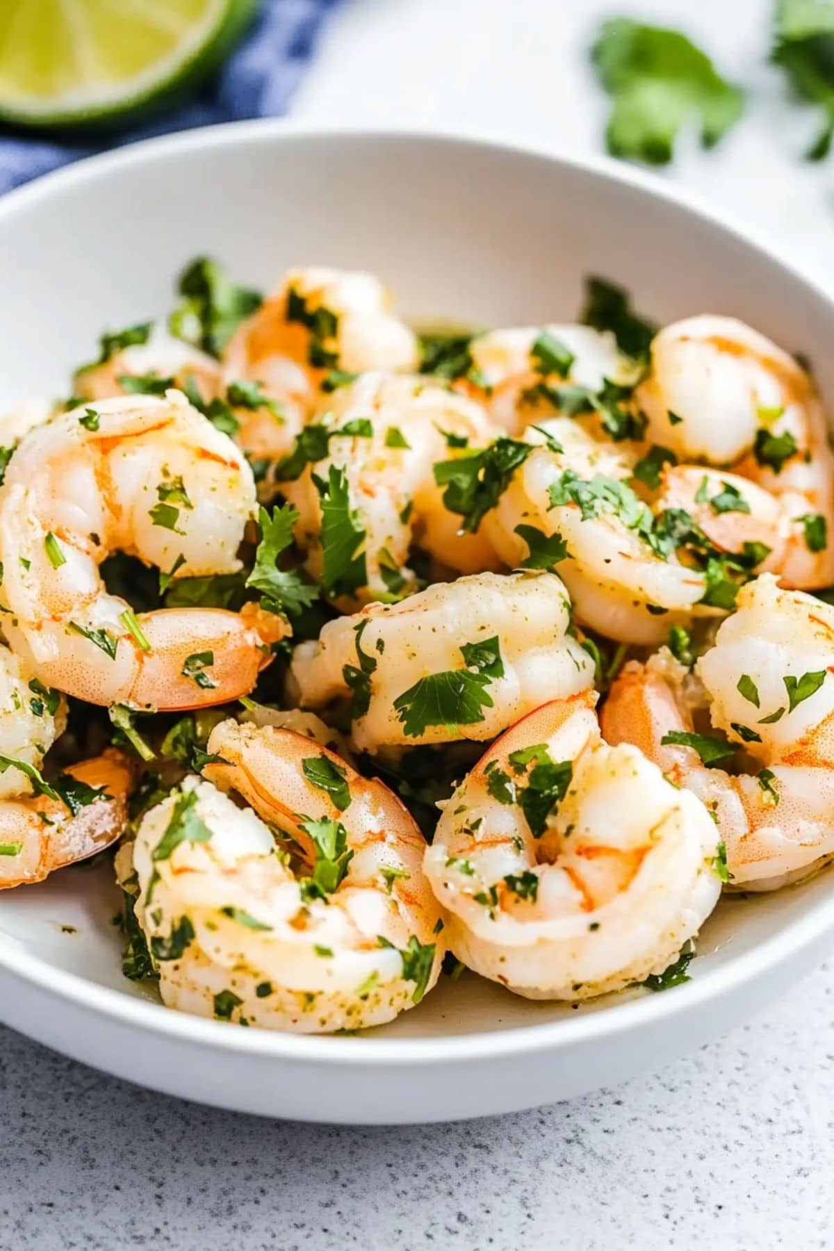 Cilantro lime shrimp served on a white bowl. 