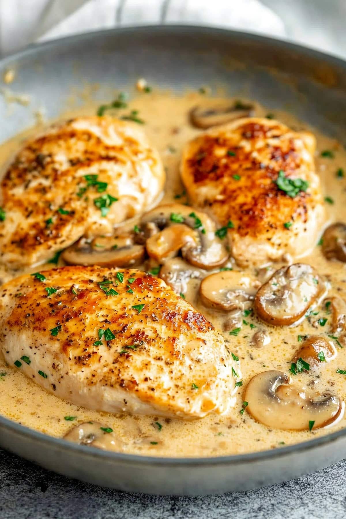 Homemade creamy chicken diane with mushrooms and herbs.
