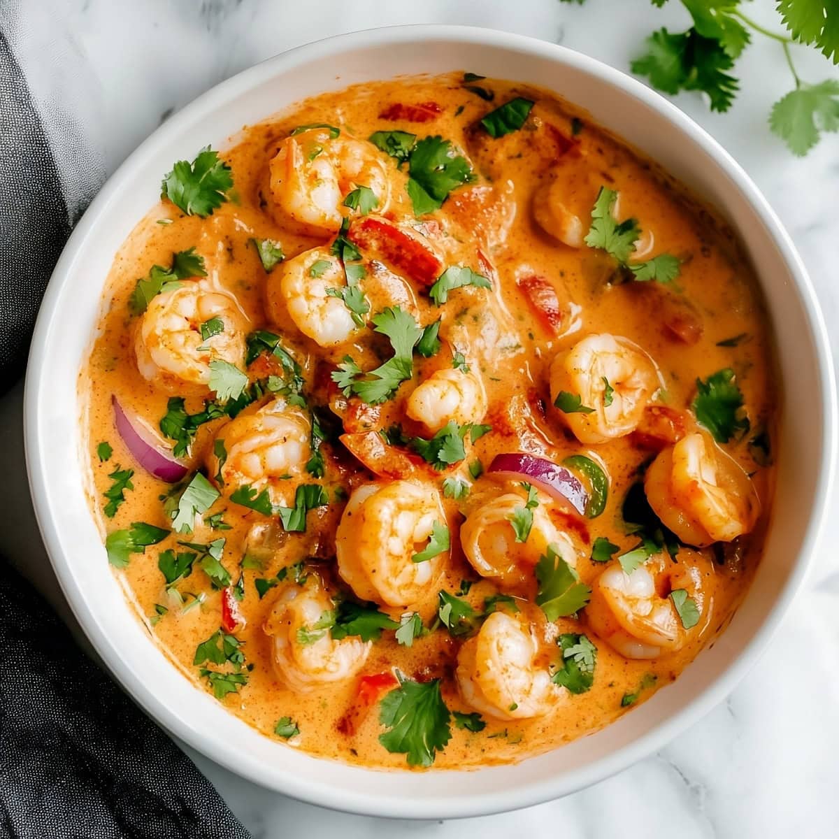 Overhead shot of creamy chipotle shrimp in a spicy, creamy sauce ready to be enjoyed.