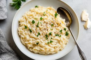 Classic homemade creamy orzo risotto in a plate.