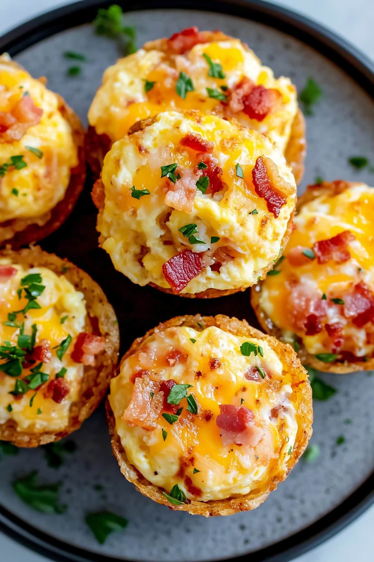 A single hash brown egg cup with a perfectly cooked egg in the center, surrounded by a crispy, golden potato shell.