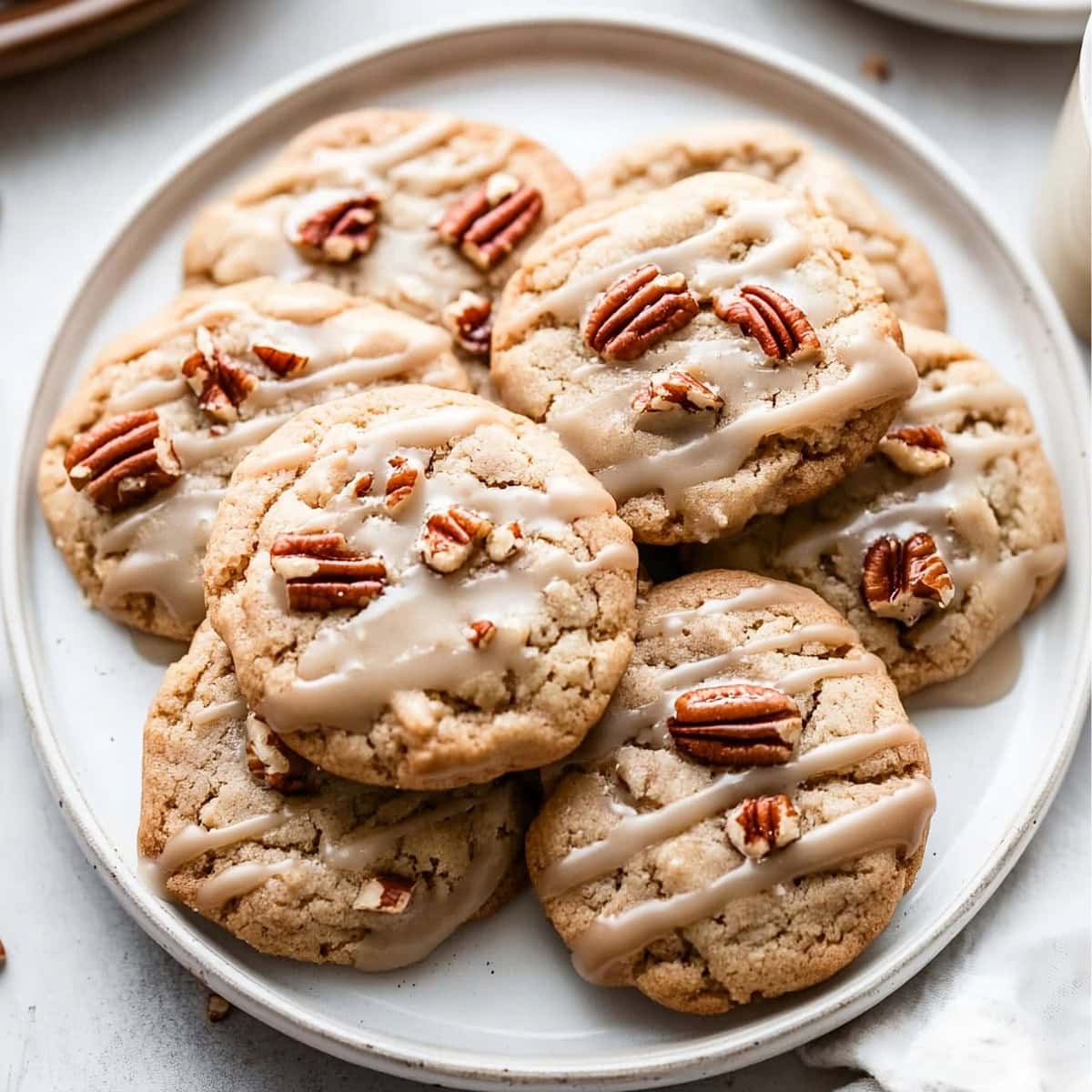 A plate of maple cookies topped with homemade maple icing.