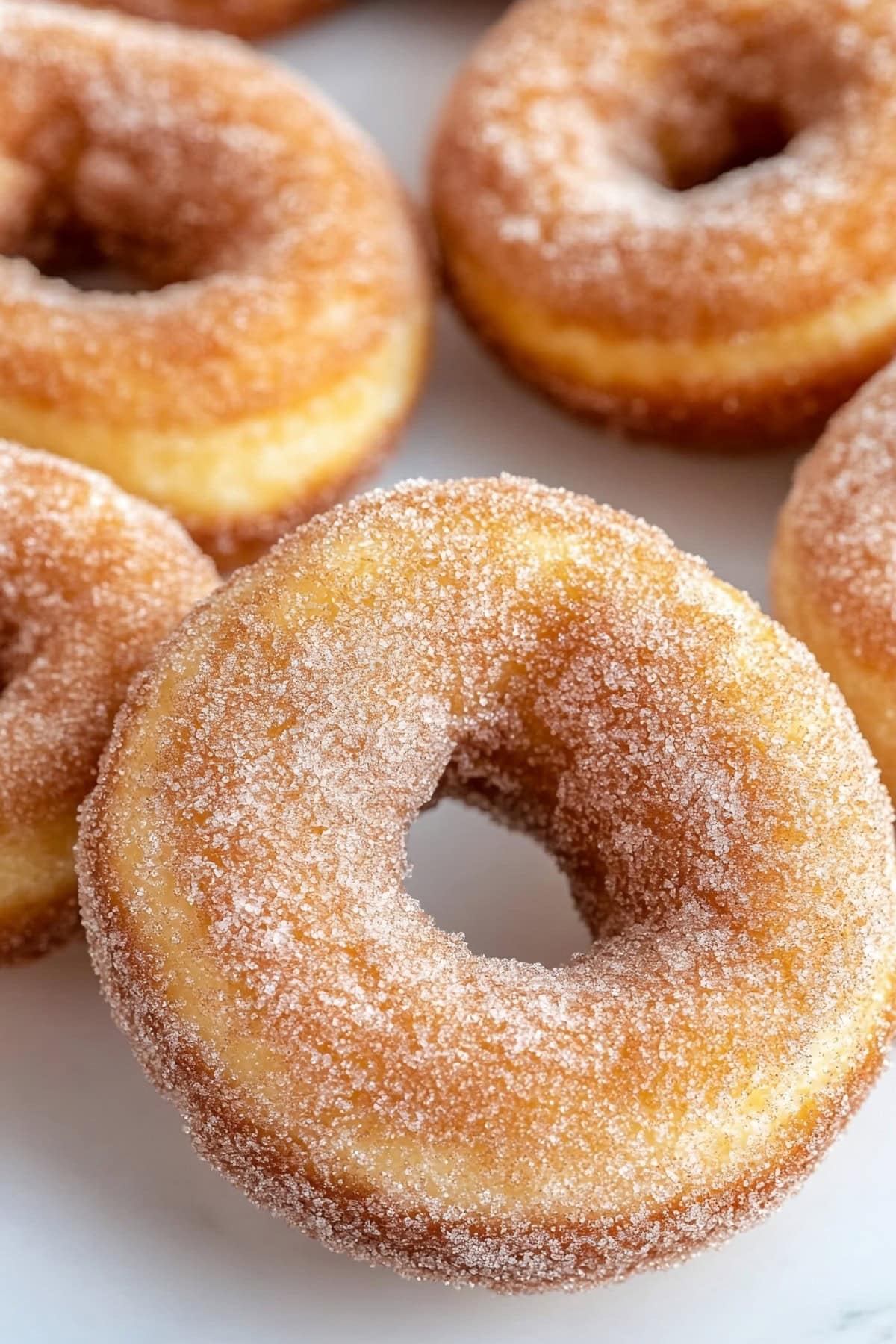 Cinnamon sugar coated biscuit donuts, close up