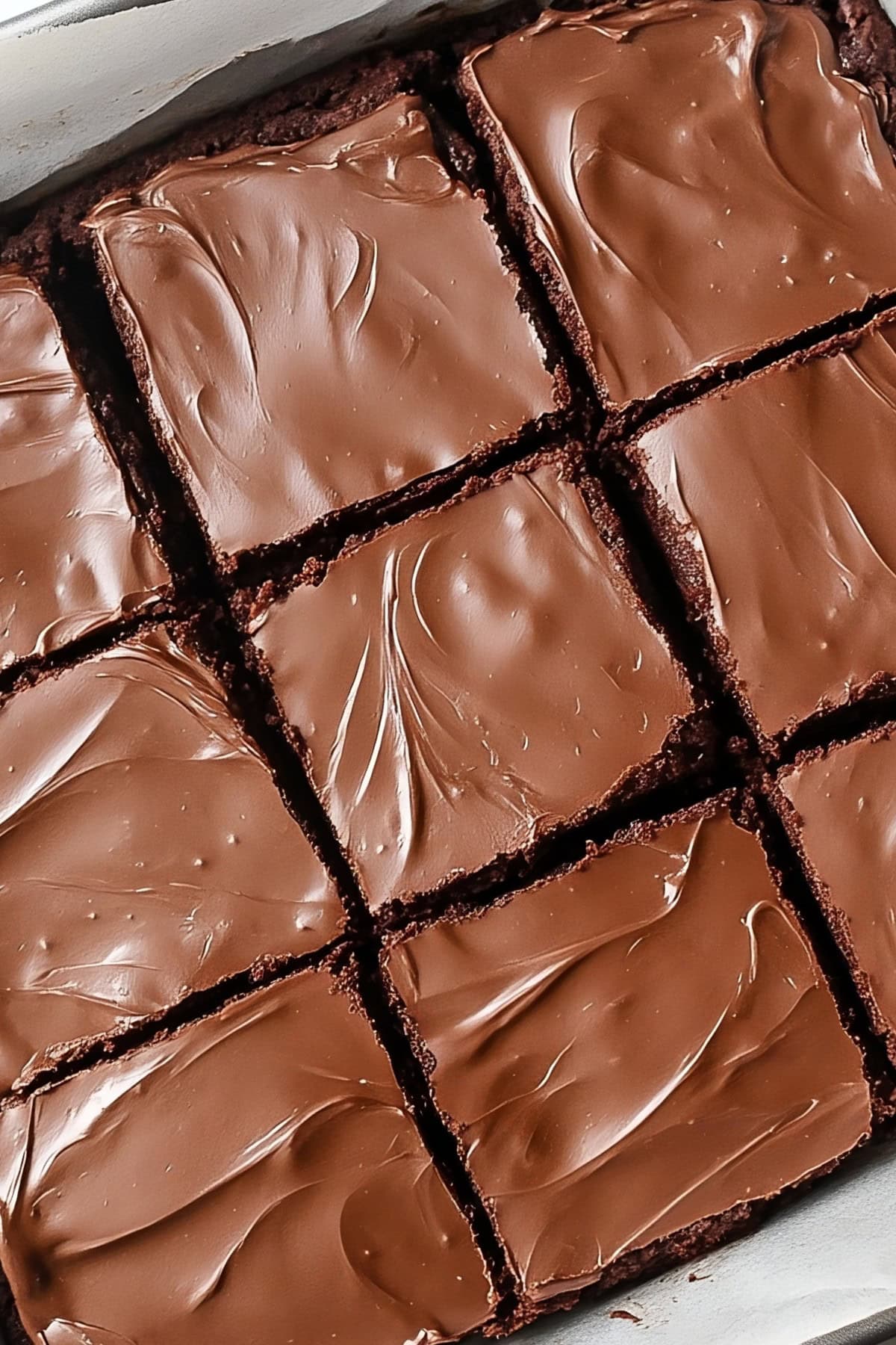 Sliced lunch lady brownies with smooth, creamy frosting, top view