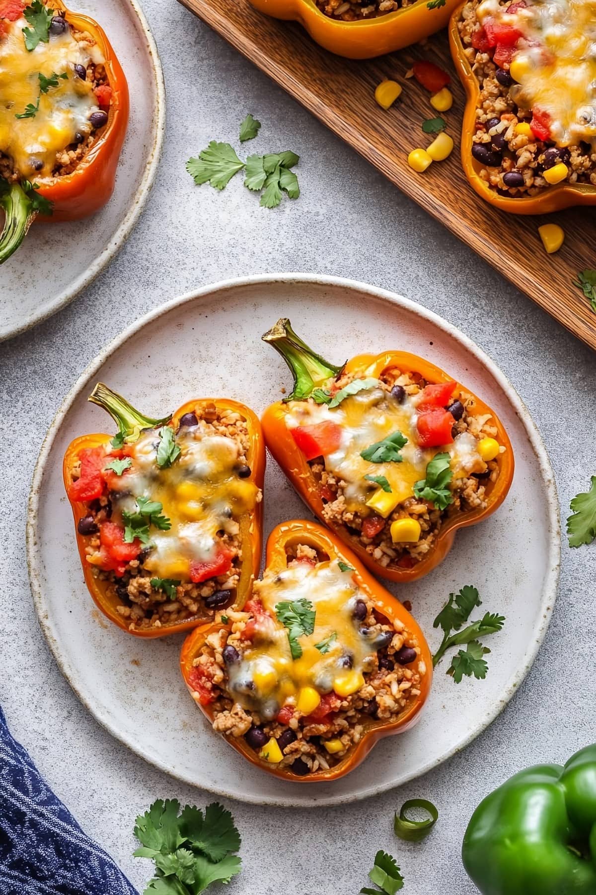 Taco stuffed peppers served in a white plate.