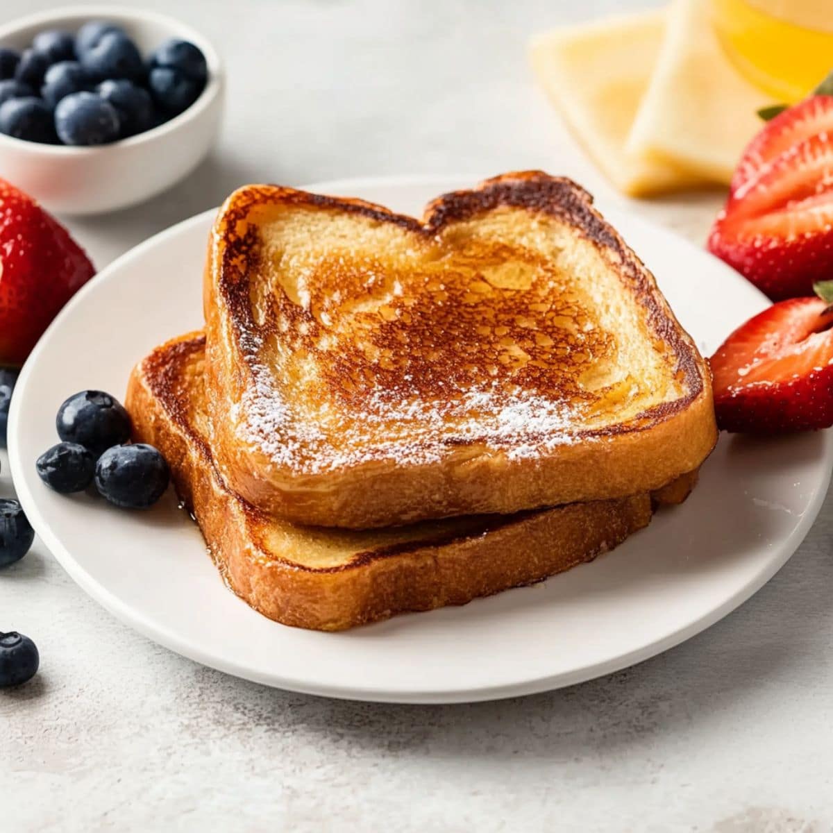 French toast sandwiches in a white plate.