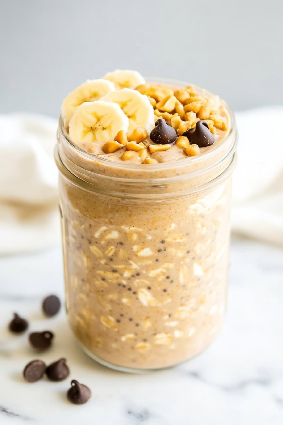 Peanut butter overnight oats in a mason jar.