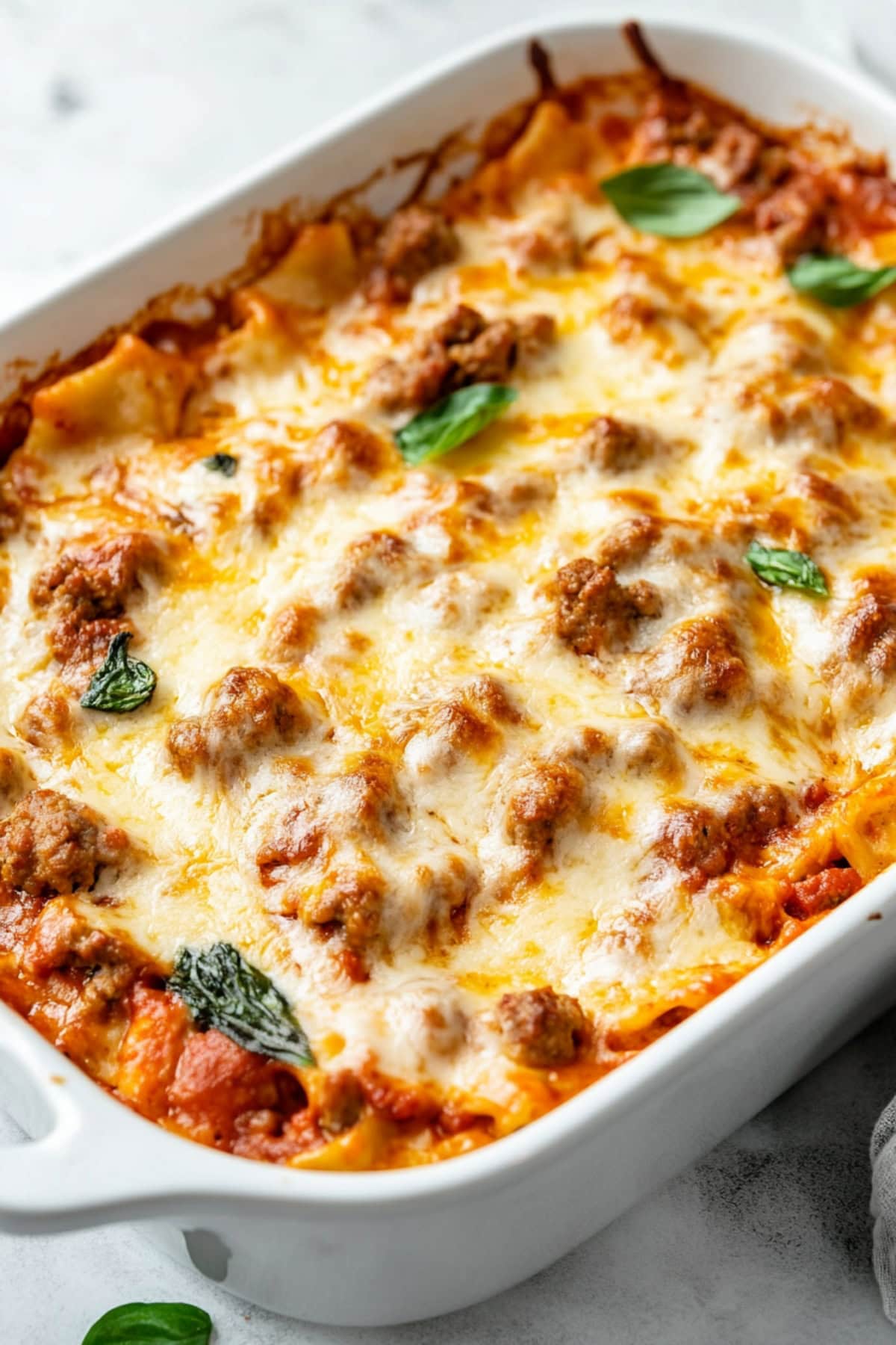 Meaty and cheesy ravioli baked in a casserole.