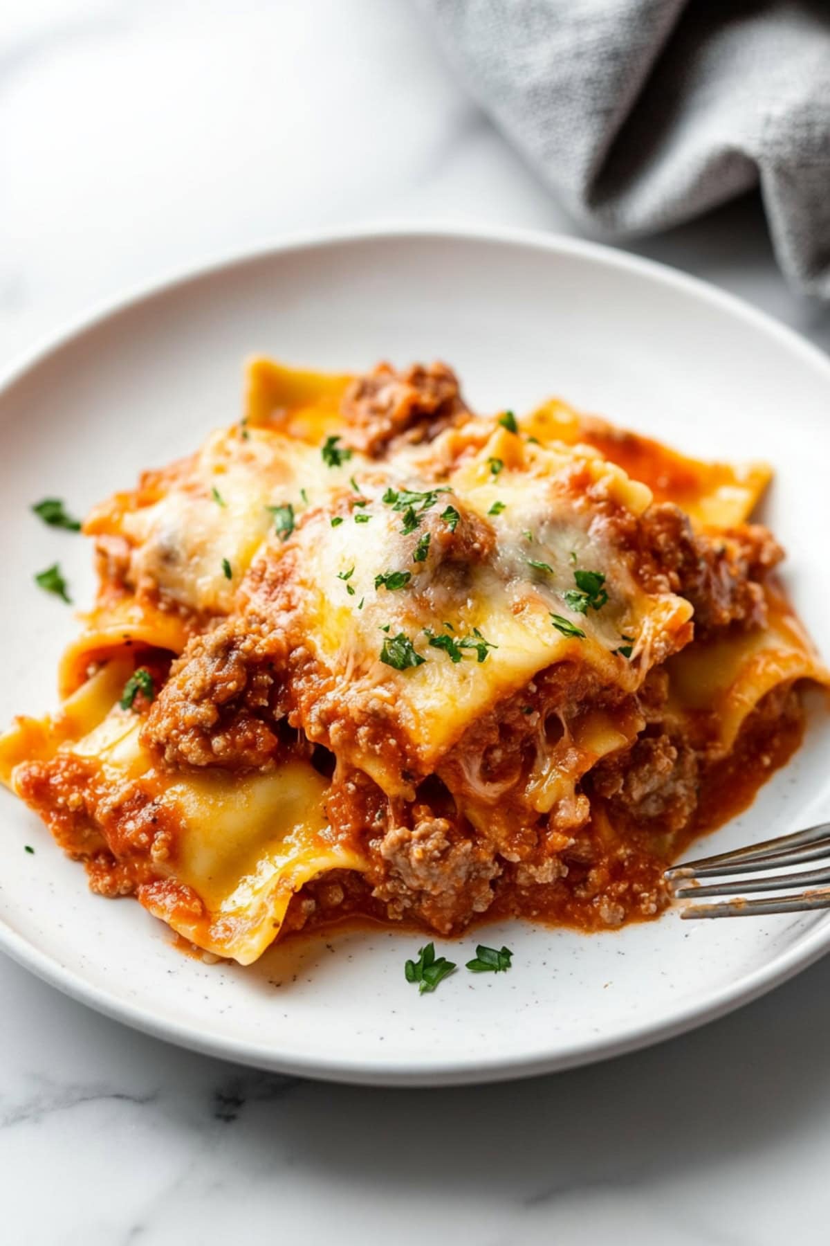 Portion of ravioli casserole in a plate.