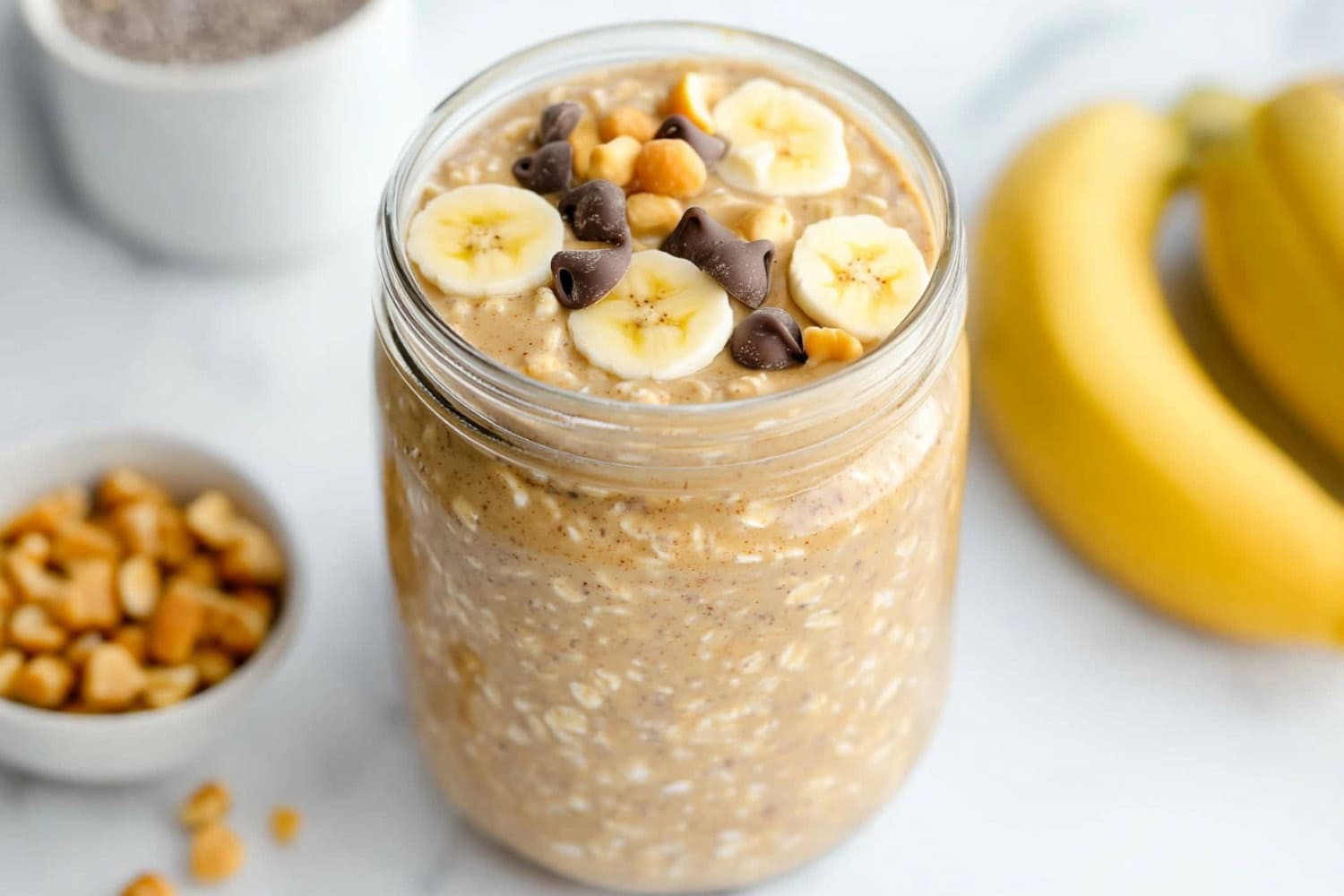 Peanut butter overnight oats served in a glass jar perfect for breakfast.