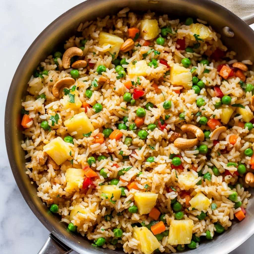 Thai pineapple fried rice in skillet pan.