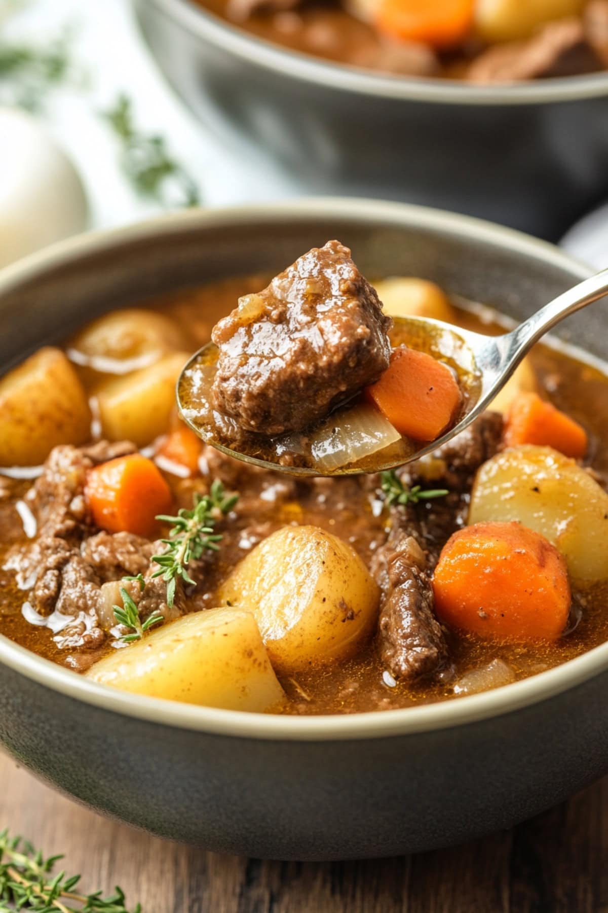 Savory homemade apple cider beef stew in a bowl.