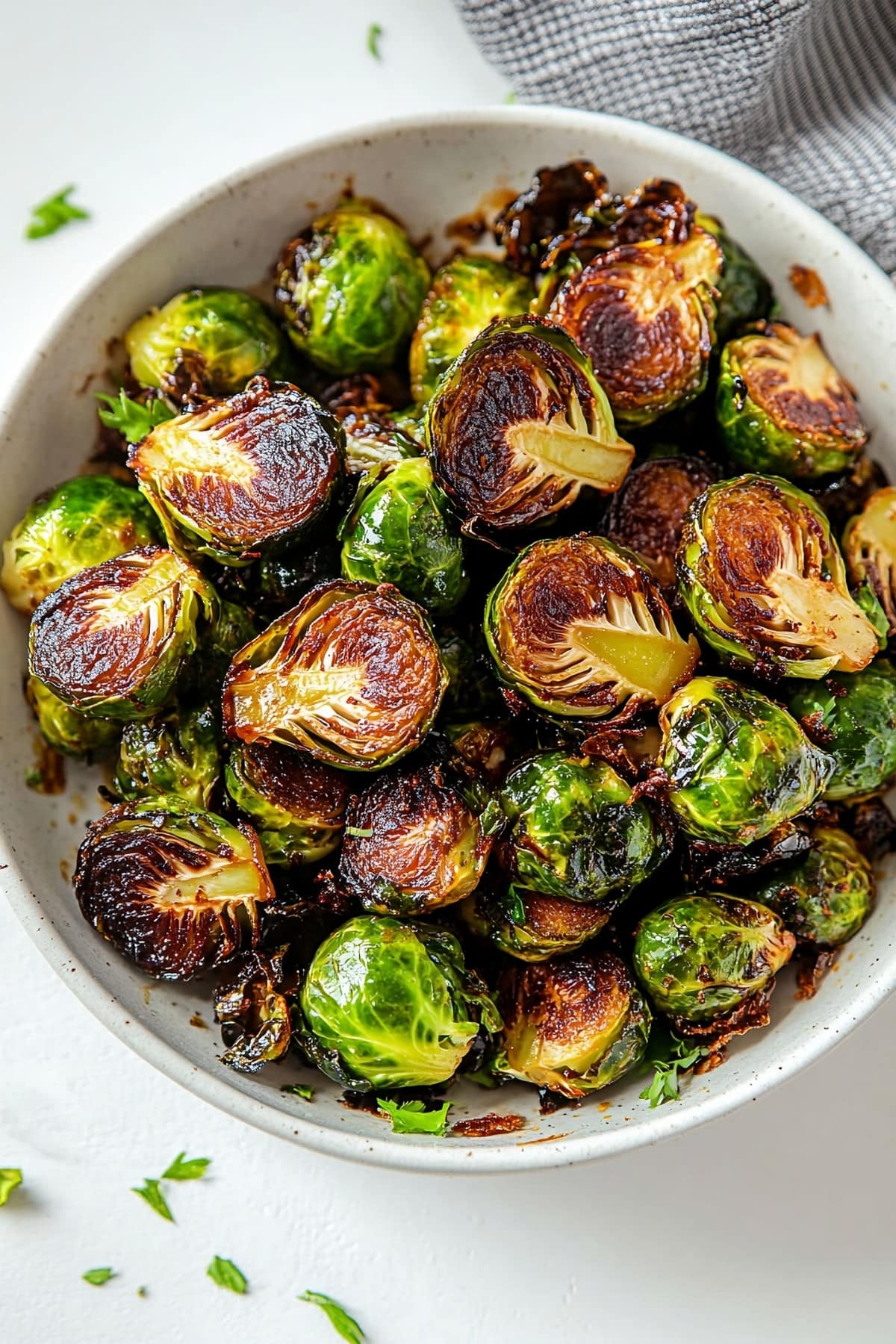 Overhead shot of caramelized brussels sprouts in a bowl.