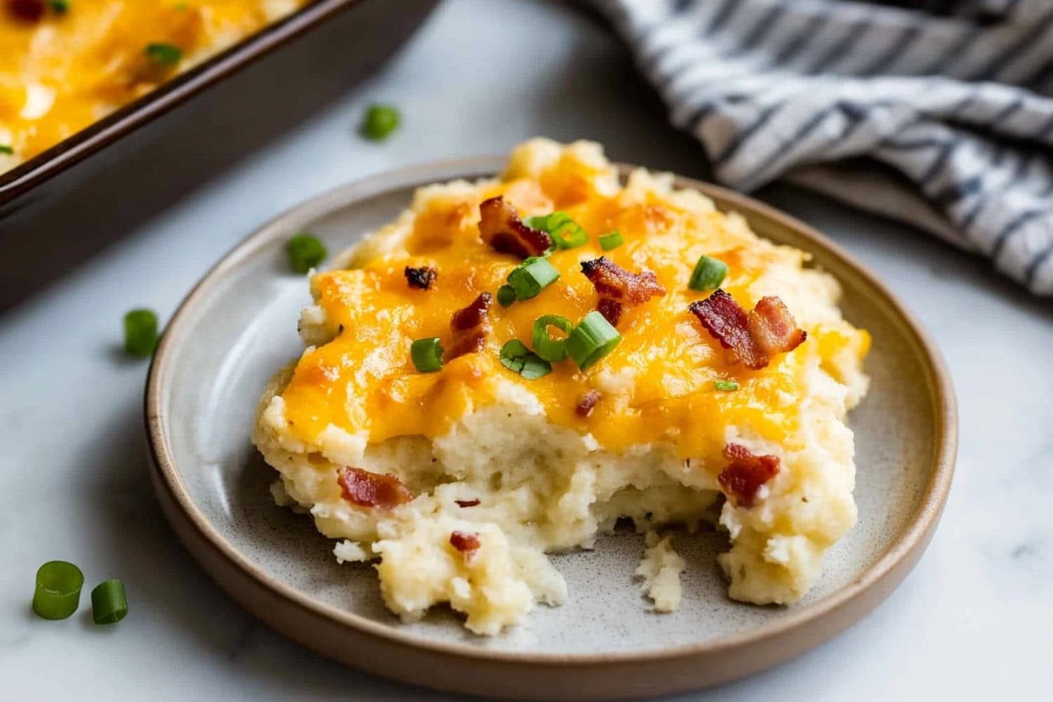 A plate of homemade loaded baked potato casserole.