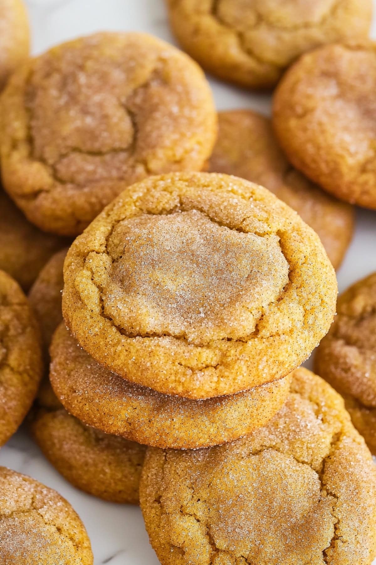 Soft and chewy homemade pumpkin snickerdoodle cookies.