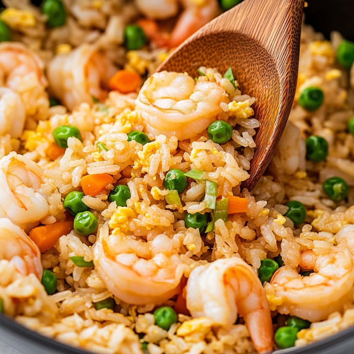 A large skillet filled with shrimp fried rice.