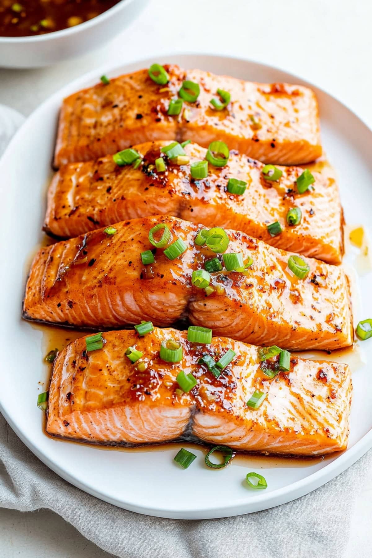 Maple glazed salmon with green onions.